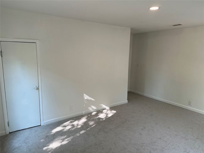 Carpeted empty room featuring baseboards, visible vents, and recessed lighting | Image 18