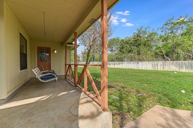 View of yard with fence and a patio | Image 21