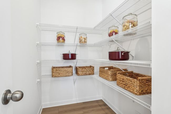 Photo is of the actual model. Spacious walk-in kitchen pantry. | Image 5