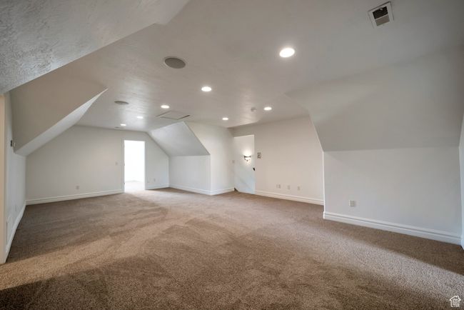 Bonus room with visible vents, vaulted ceiling, carpet floors, and baseboards | Image 22