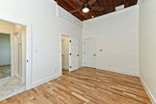 Second bedroom featuring wood ceiling, a towering ceiling, and light wood-style flooring | Image 19
