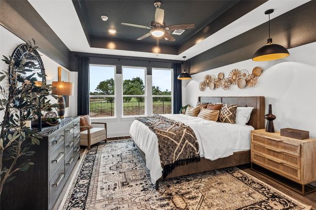 Bedroom with a tray ceiling and wood finished​​‌​​​​‌​​‌‌​‌‌​​​‌‌​​‌‌​‌​​​​​‌ floors | Image 11
