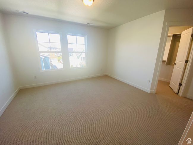 Spare room with light carpet and baseboards | Image 16