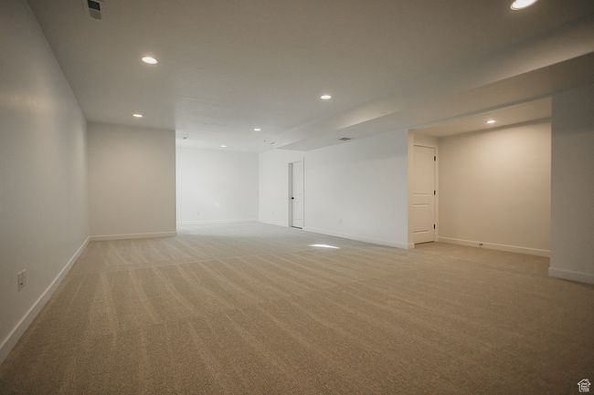Below grade area featuring recessed lighting, light carpet, and baseboards | Image 38