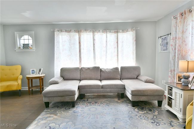 Living room with baseboards and wood finished floors | Image 19
