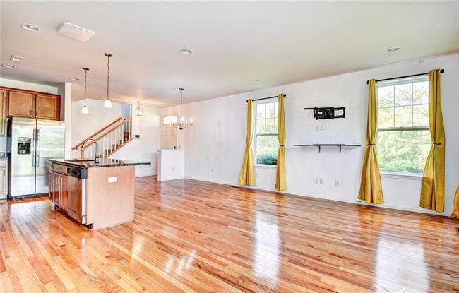 Open floor plan with hardwood flooring | Image 7