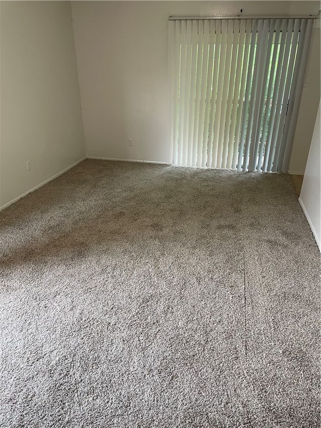 Carpeted spare room featuring baseboards | Image 4
