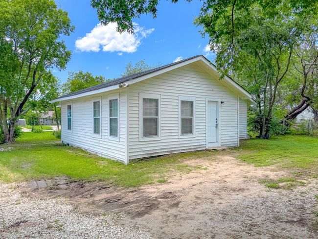 View of property exterior featuring a lawn | Image 32