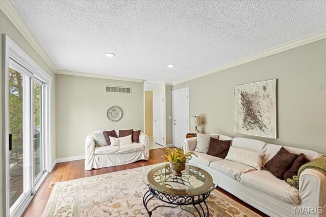 Sliding doors lead to the deck and backyard | Image 20