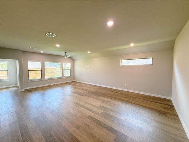 Unfurnished room with baseboards, wood finished floors, recessed lighting, and ceiling fan | Image 6