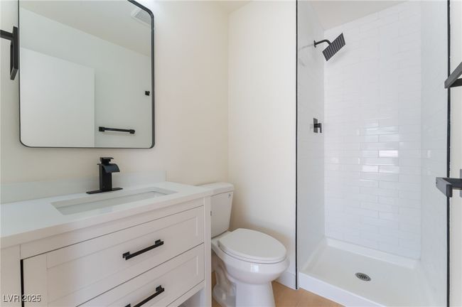 Full bathroom with a stall shower and vanity | Image 39