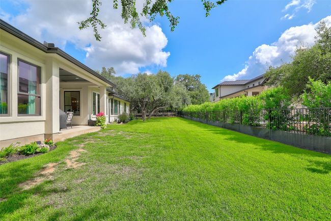Fenced backyard featuring a patio area | Image 34