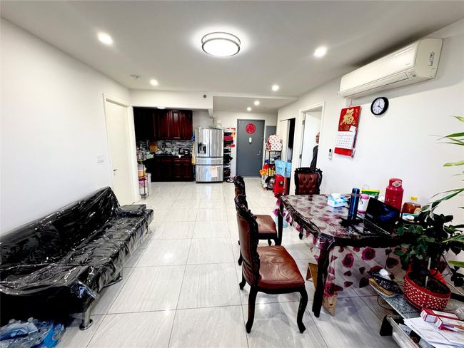 Dining space featuring a wall unit AC | Image 4