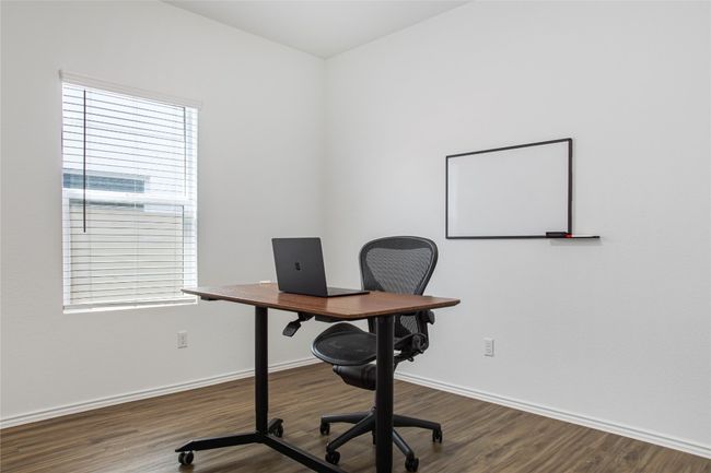 Office with baseboards, wood finished floors, and plenty of natural light | Image 18