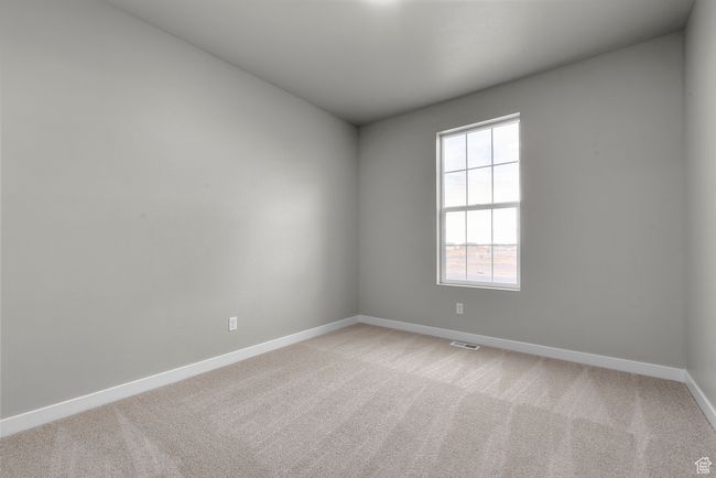 Empty room with baseboards and light carpet | Image 6