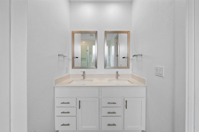Full bathroom with double vanity and a sink | Image 21