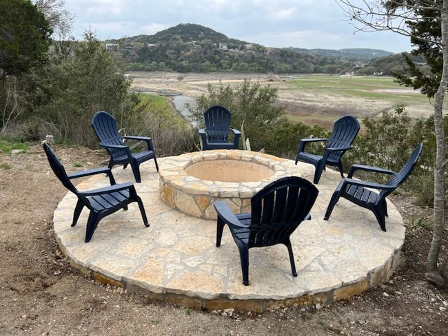 Gather around this inviting firepit, perfect for cozy evenings with a stunning view. | Image 20