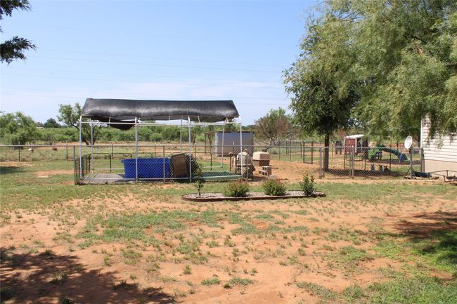 View of yard featuring an outbuilding | Image 12
