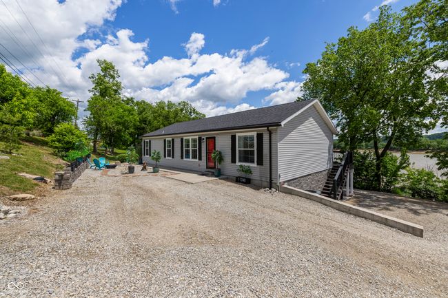 view of front of property with stairway and a shingled roof | Image 64