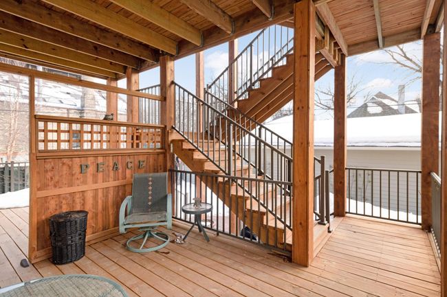 A beautifully envisioned and crafted 3-story deck was built in 2020. Each of the building's 5 condos has its own private deck space. Imagine enjoying a glass of wine here on a summer evening! | Image 23