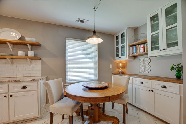 Dining area featuring light tile patterned floors | Image 16