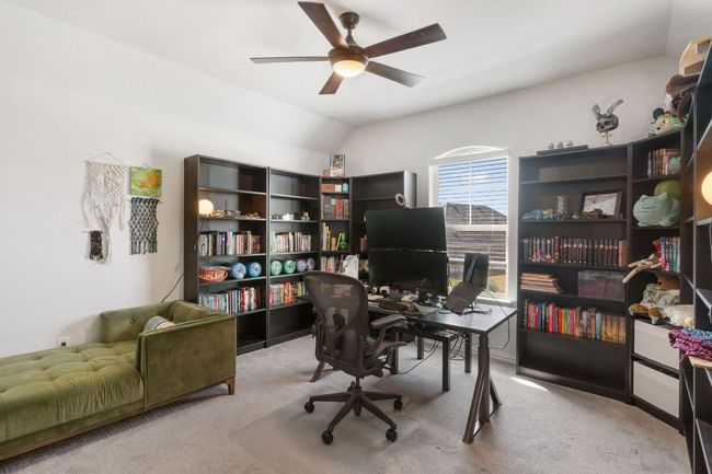 This bedroom located on the second floor is being used as an office. | Image 25