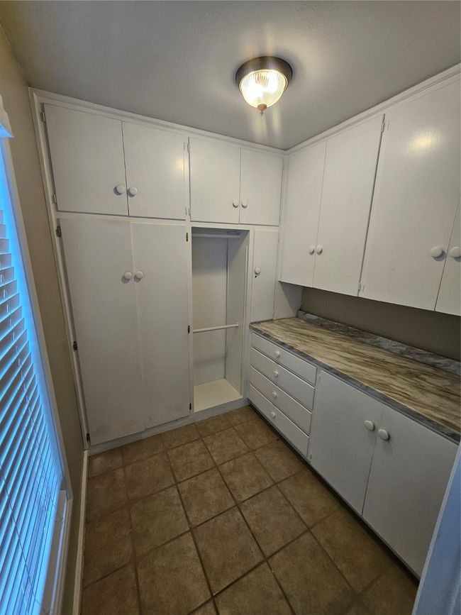 Kitchen with white cabinetry | Image 12
