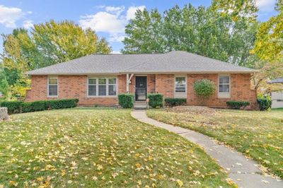 Ranch-style home with a front yard | Image 1