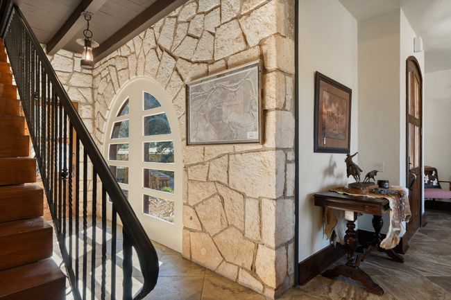 Stairway featuring stone finish floor, wooden ceiling, beamed ceiling, and baseboards | Image 8