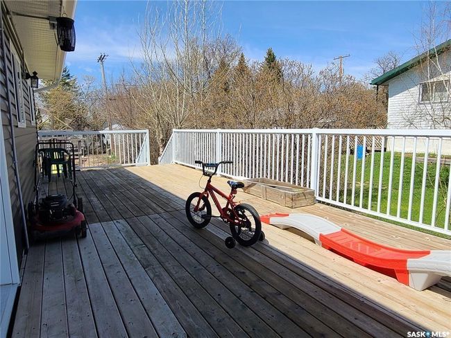 Wooden terrace with a lawn | Image 4