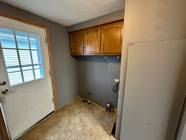 Side Entrance with Washer and Dryer hook up to the left | Image 8