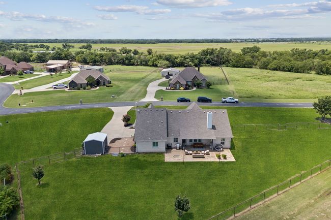 Aerial view of sparsely populated area featuring a pastoral area | Image 25