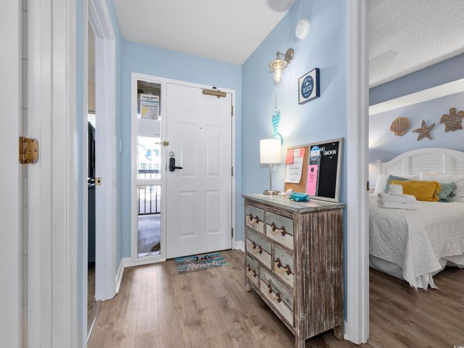 Foyer featuring wood finished floors and baseboards | Image 14