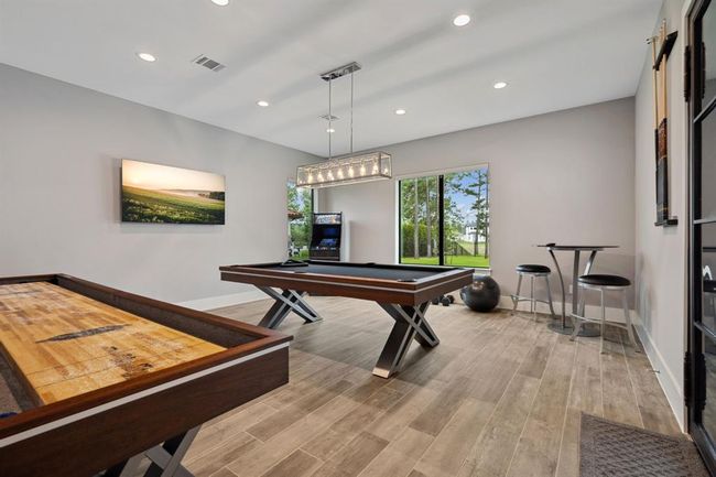 Spacious game room offers endless possibilities—ideal for a home gym, entertainment space, or versatile flex room. | Image 21