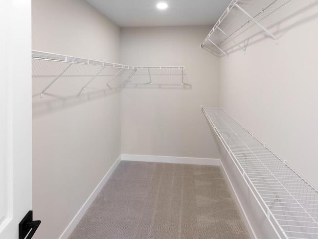 The perfect storage solution with this impressive 10x6 walk-in closet, providing plenty of space for organizing your wardrobe and accessories with ease. | Image 27