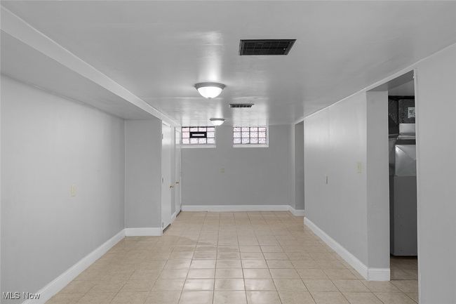 below grade area with baseboards and visible vents | Image 25