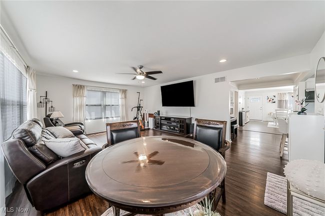Dining room with visible vents, recessed lighting, ceiling fan, and dark wood-type flooring | Image 18