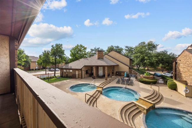 View of pool with a pool with connected hot tub and a patio area | Image 33
