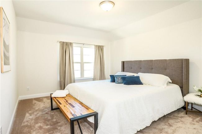 Bedroom with carpet and baseboards | Image 24