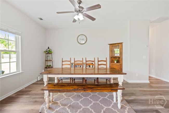 Great room currently being used as a dining area. | Image 8