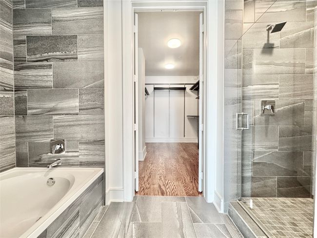 Bathroom featuring a spacious closet | Image 19