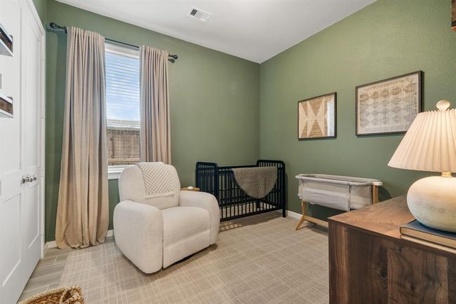 Trending color in 1 of 3 secondary bedrooms. | Image 24
