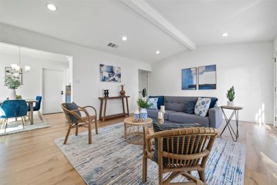 Living room with beautiful fireplace, plenty of natural light, and vaulted ceilings! | Image 3