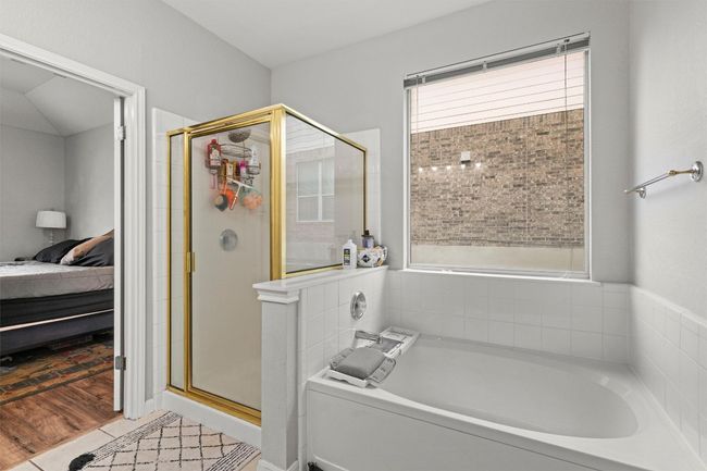 Ensuite bathroom with wood finished floors, a bath, ensuite bathroom, and a shower stall | Image 12