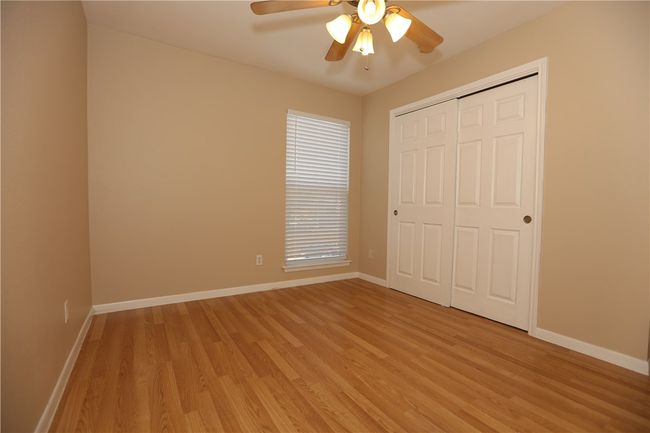 Large secondary bedroom with generous-sized closet, right next to secondary bath. | Image 8