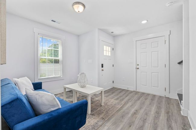 Living area featuring recessed lighting, baseboards, visible vents, and light wood-type flooring | Image 24