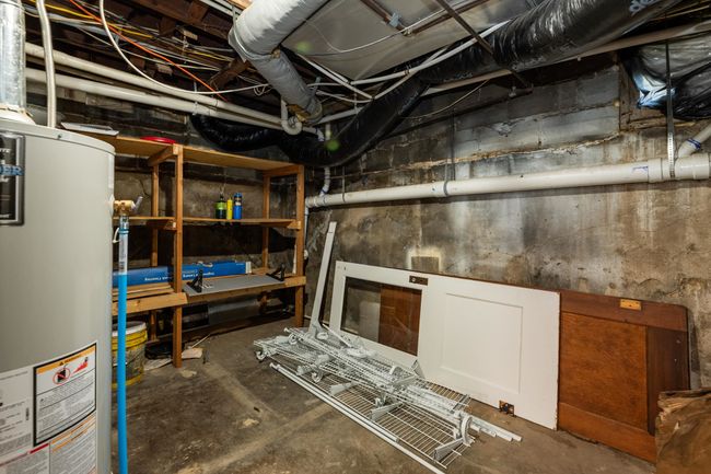 Unfinished below grade area with gas water heater | Image 32