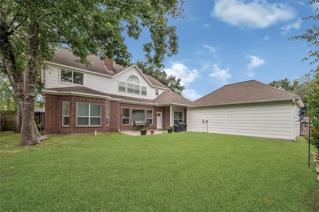 Nicely sized backyard with mature oaks. | Image 37