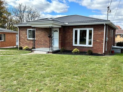 Front view of home featuring a front lawn | Image 1