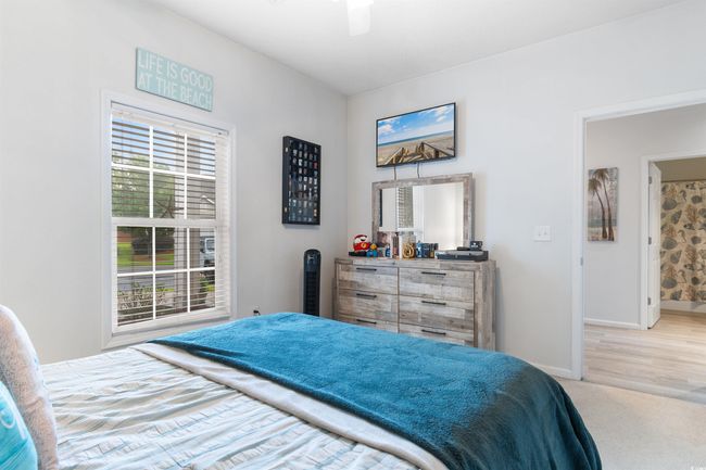 Carpeted bedroom with baseboards and ceiling fan | Image 18
